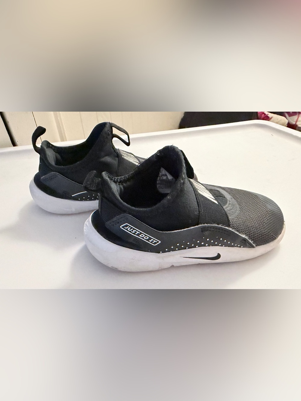 Nike Kids Black and White Slip-On Sneakers